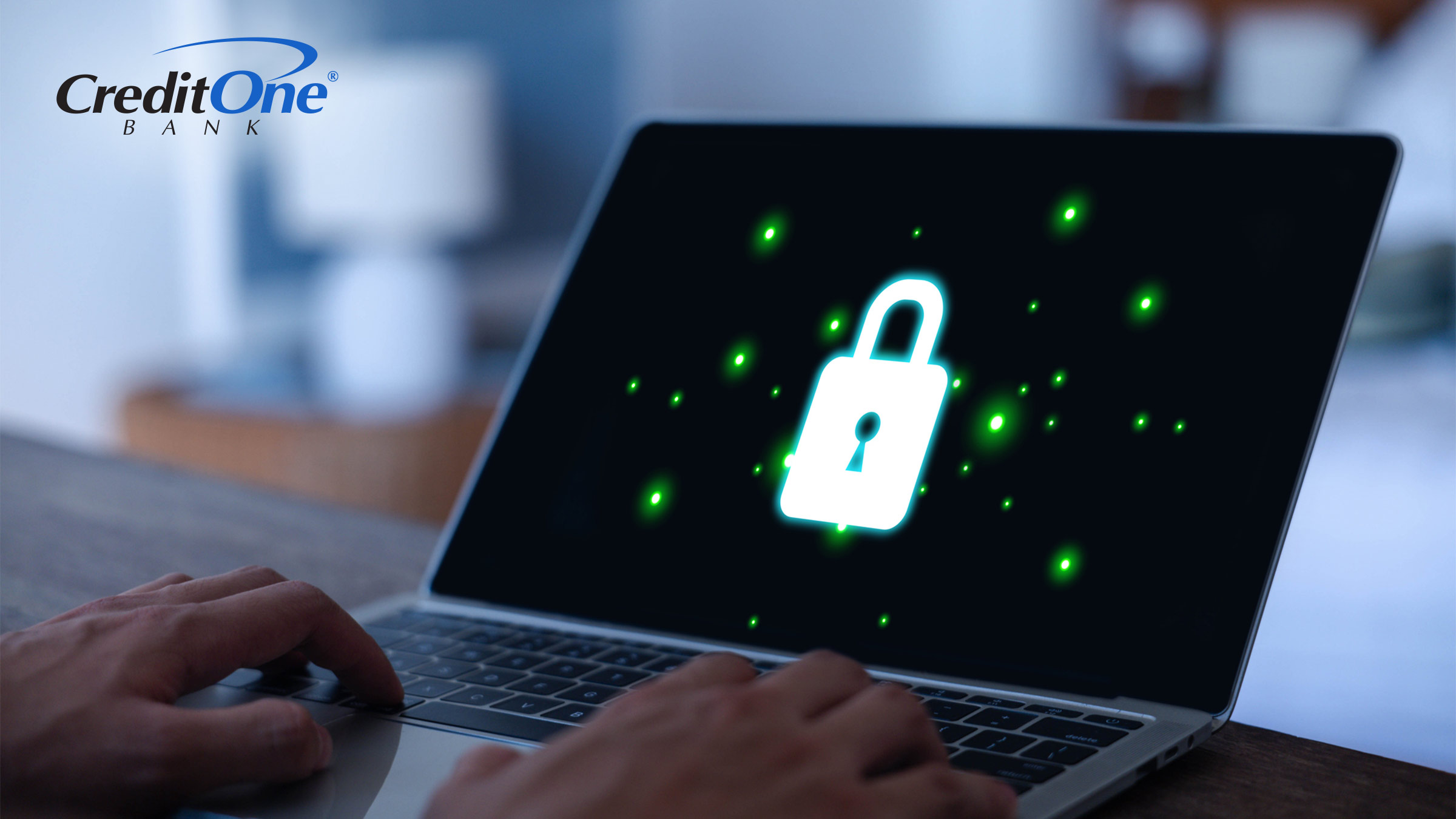 A man types on his laptop, which displays a glowing green lock icon. The lock is a symbol of security and can represent actions like protecting your bank account.