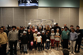 One For The Community check presentation event