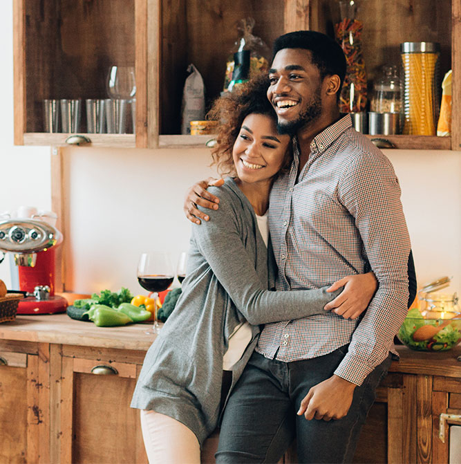 Young couple hugging in a kitchen